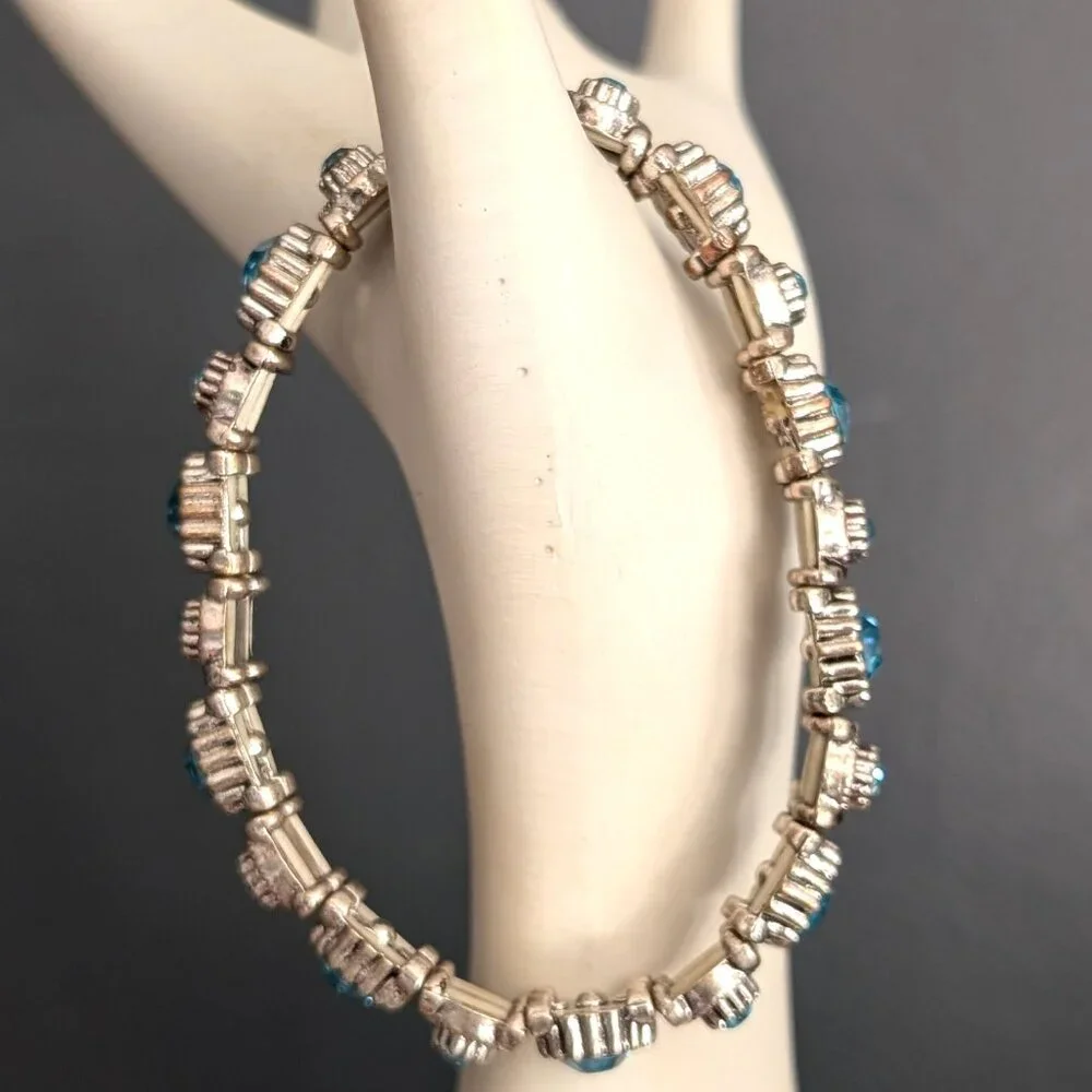 Silver stretch bracelet with blue faceted glass beads